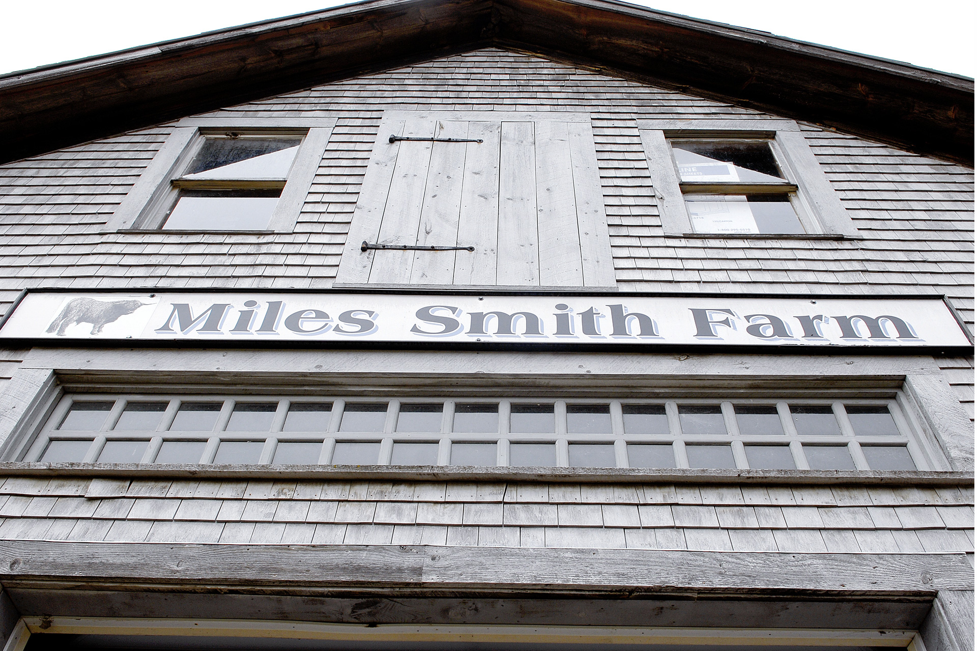Barn with large sign that says Miles Smith Farm 