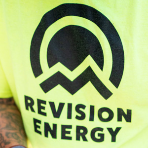 ReVision Energy's logo on a tee shirt.