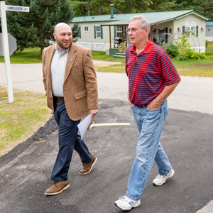 Two men walk through Black Bear Village Cooperative