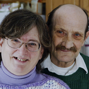 Man and woman smiling at camera