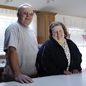 Man and woman standing in their kitchen